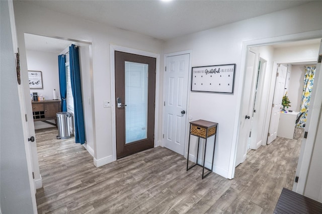 entryway with light hardwood / wood-style flooring