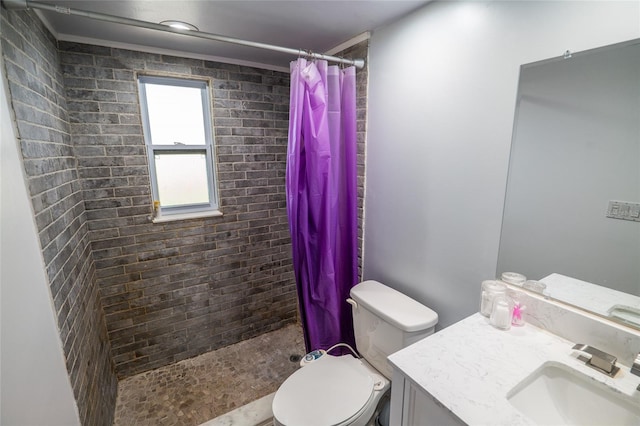 bathroom with curtained shower, vanity, and toilet