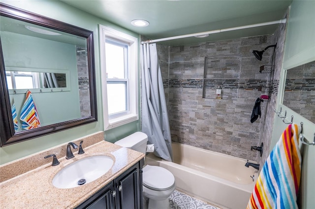 full bathroom with shower / bath combination with curtain, vanity, and toilet