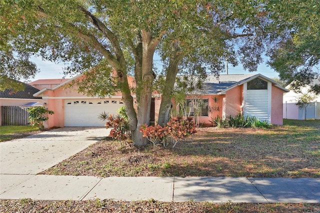 single story home featuring a garage