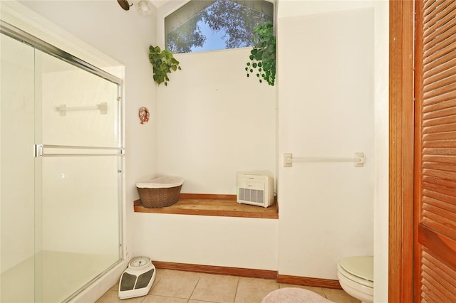 bathroom featuring walk in shower, tile patterned flooring, lofted ceiling, and toilet