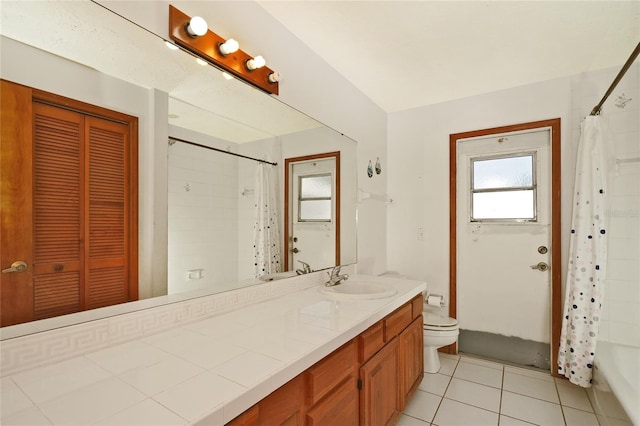 bathroom featuring tile patterned floors, vanity, and toilet