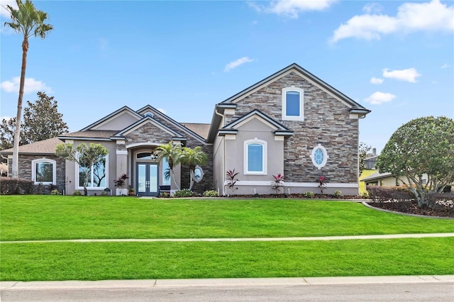 view of front of property with a front lawn and french doors