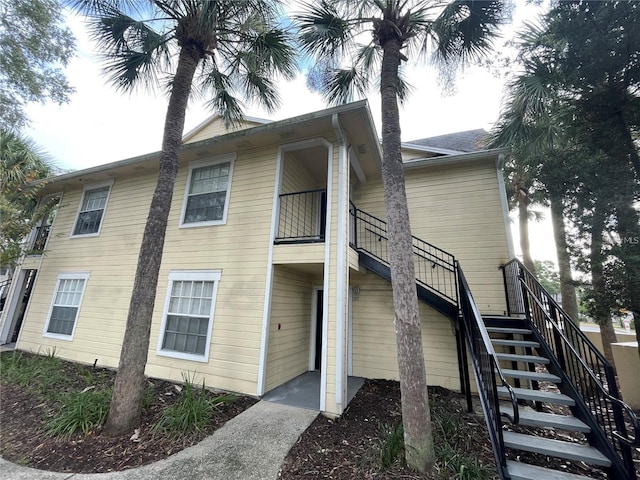 view of side of property featuring a balcony