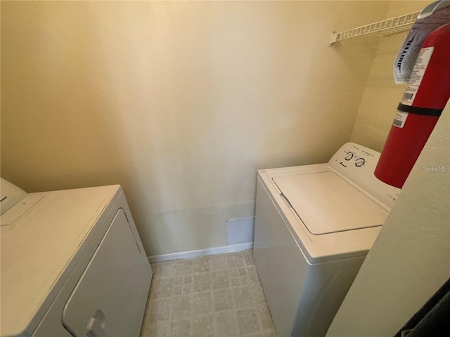 clothes washing area featuring washing machine and dryer