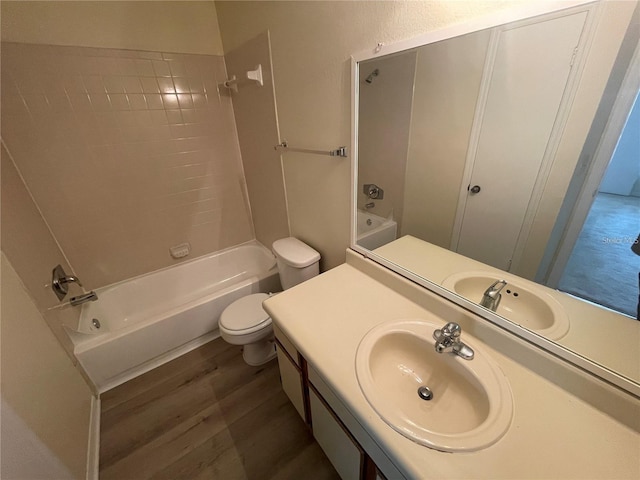 full bathroom featuring vanity, toilet, shower / bathing tub combination, and hardwood / wood-style flooring