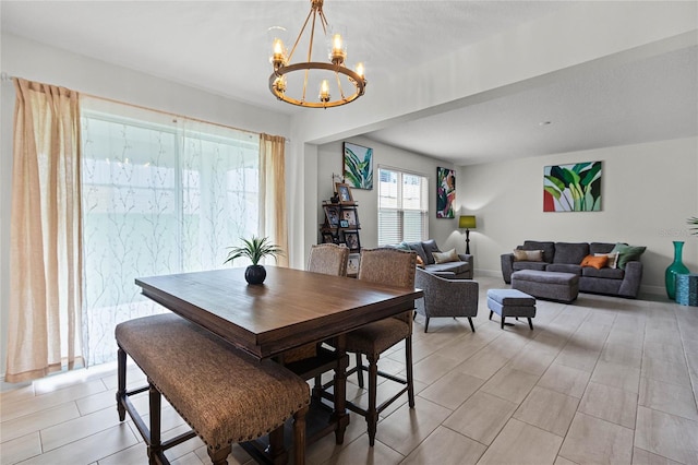 dining space featuring a chandelier