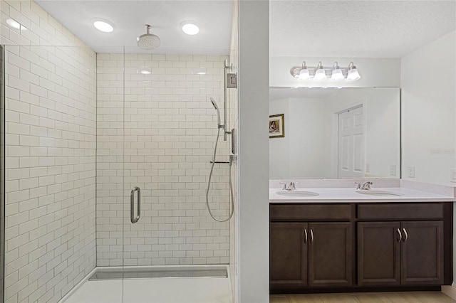 bathroom with vanity and walk in shower