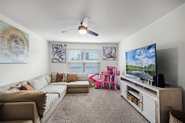 living room featuring carpet flooring, ceiling fan, and a textured ceiling