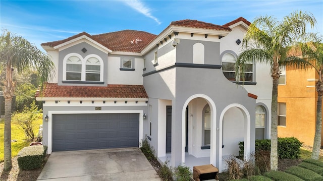 mediterranean / spanish-style house featuring a garage