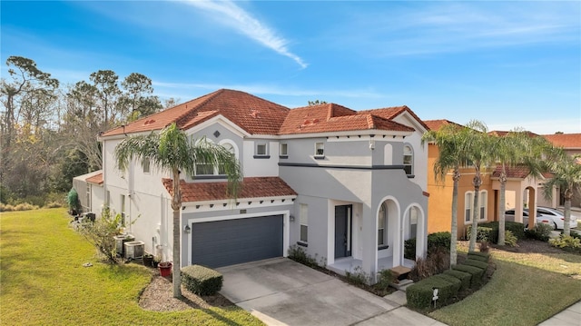 mediterranean / spanish-style home with cooling unit, a garage, and a front lawn