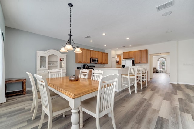 dining room with light hardwood / wood-style flooring