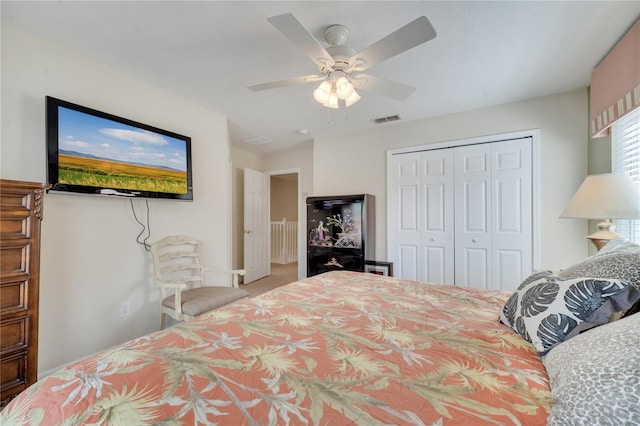 bedroom featuring ceiling fan and a closet