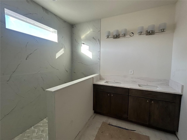 bathroom featuring vanity and walk in shower