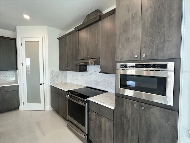 kitchen with dark brown cabinetry, backsplash, and appliances with stainless steel finishes