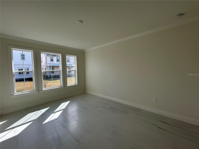 empty room featuring ornamental molding