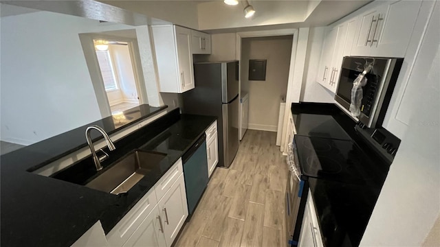 kitchen featuring white cabinetry, sink, light hardwood / wood-style flooring, black / electric stove, and dishwashing machine