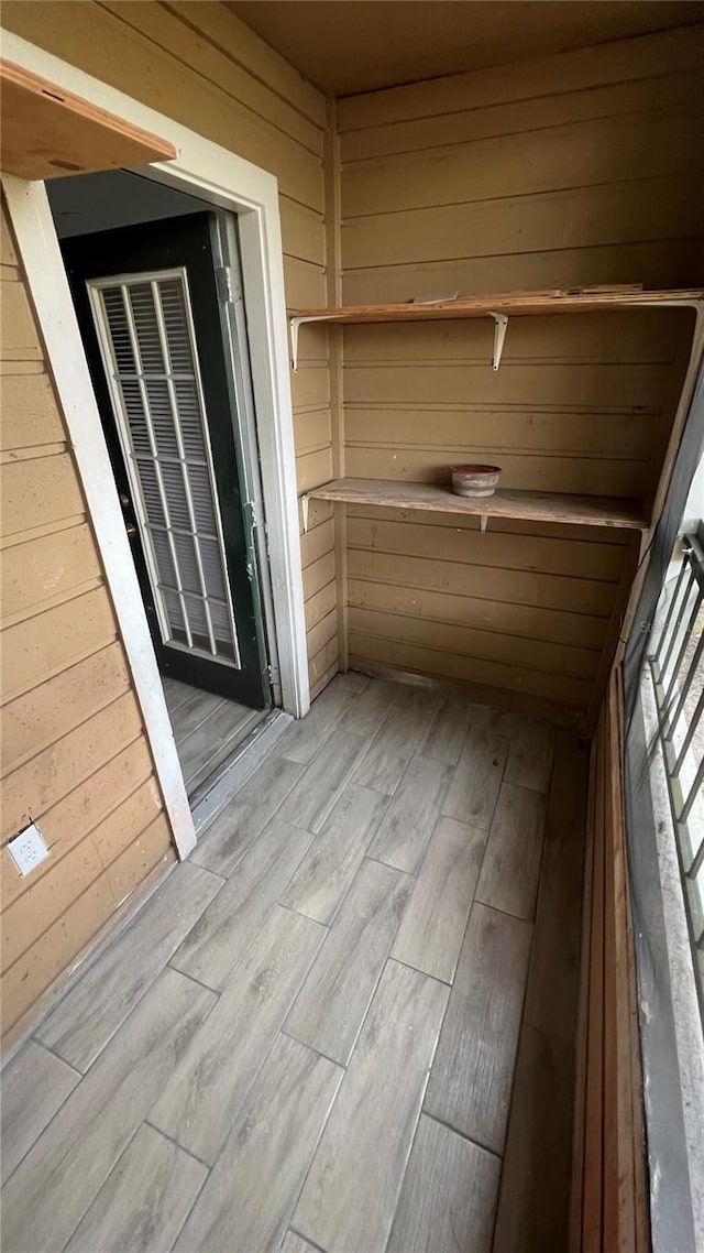 interior space featuring wood walls