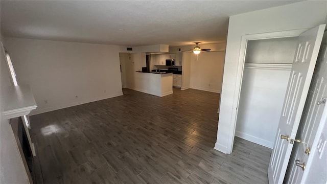 unfurnished living room featuring dark hardwood / wood-style flooring