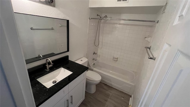 5587 Devonbriar Way Unit 104, Orlando, FL 32822 - bathroom featuring toilet, vanity, and shower / bath combination