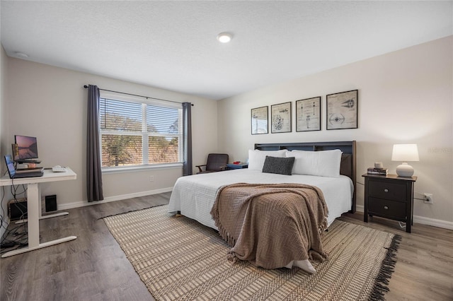 bedroom with hardwood / wood-style flooring