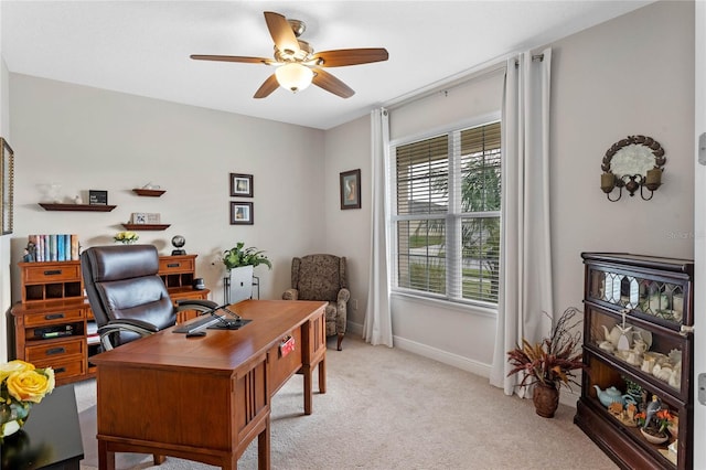 carpeted office with ceiling fan