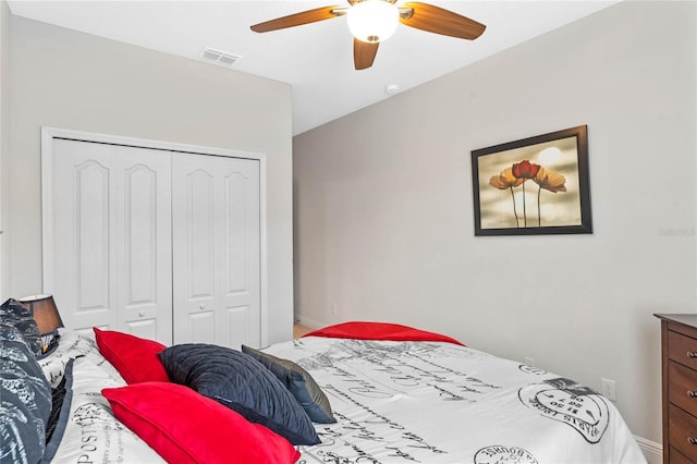 bedroom featuring ceiling fan and a closet