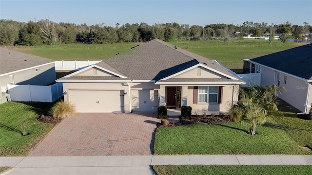 view of front facade with a garage and a front yard