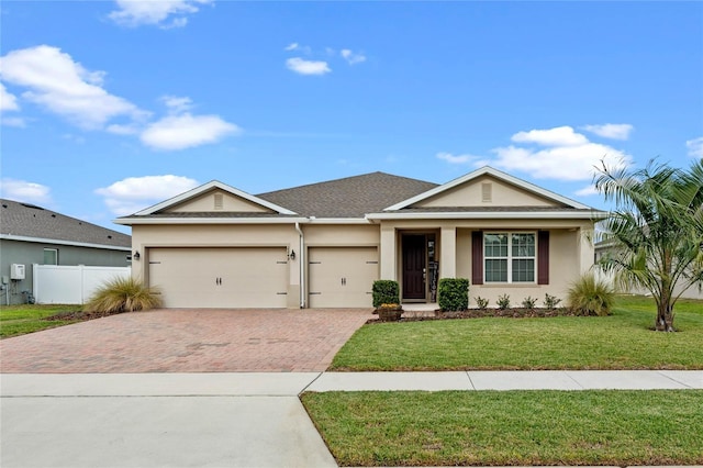 view of front of property with a garage and a front yard