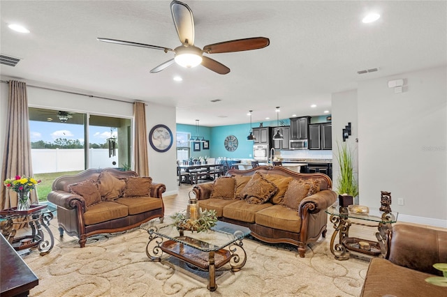 living room with ceiling fan