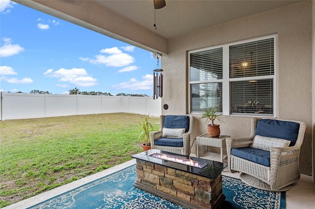 view of patio / terrace featuring an outdoor fire pit