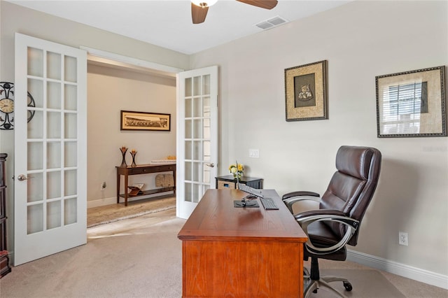 office area featuring light colored carpet, ceiling fan, and french doors