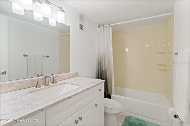 full bathroom with tile patterned flooring, shower / bath combination with curtain, toilet, and vanity