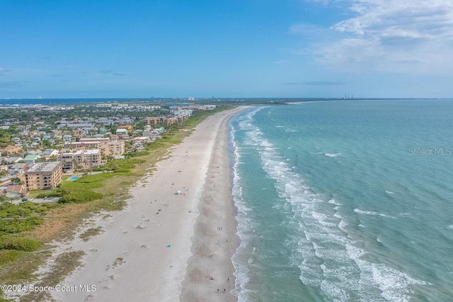 bird's eye view featuring a view of the beach and a water view