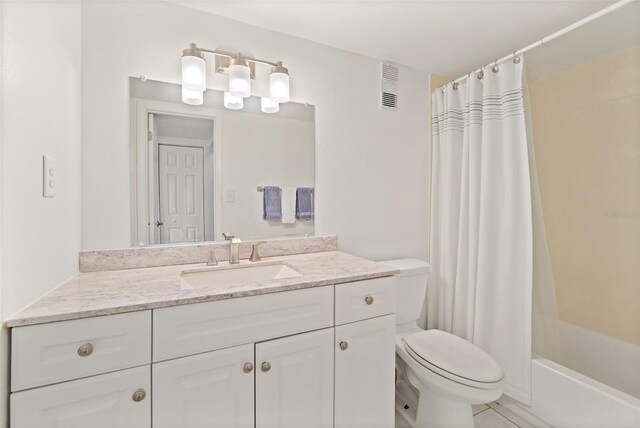 7520 Ridgewood Ave Unit 205, Cape Canaveral, FL 32920 - full bathroom featuring toilet, vanity, shower / bath combination with curtain, and visible vents