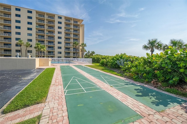 7520 Ridgewood Ave Unit 205, Cape Canaveral, FL 32920 - view of home's community featuring fence and shuffleboard