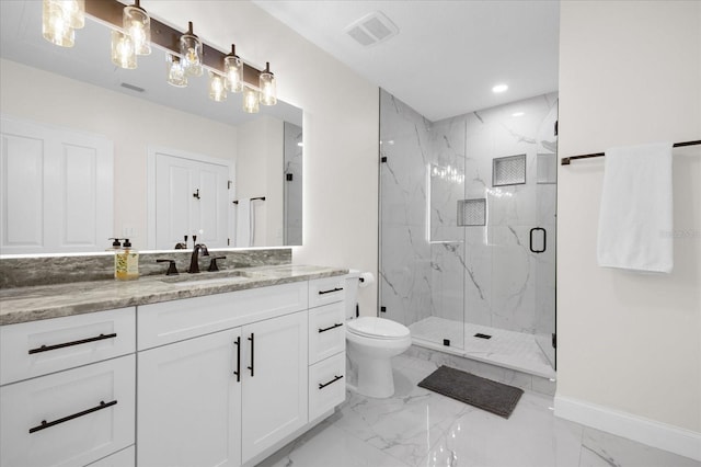 bathroom with vanity, toilet, and an enclosed shower