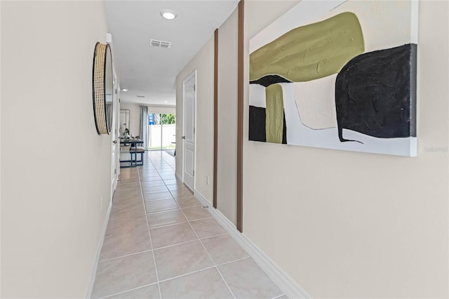 corridor featuring light tile patterned flooring