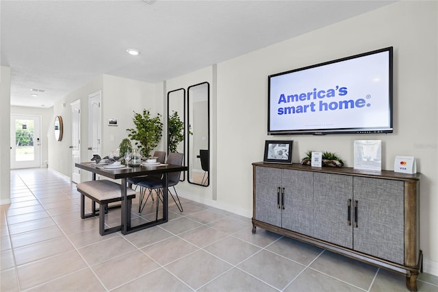 dining area featuring light tile patterned flooring