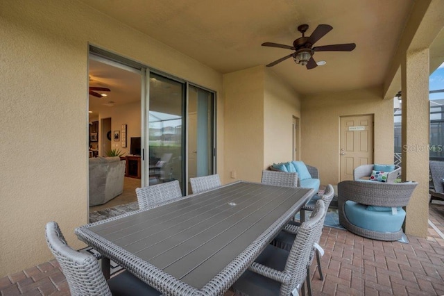 view of patio / terrace featuring ceiling fan