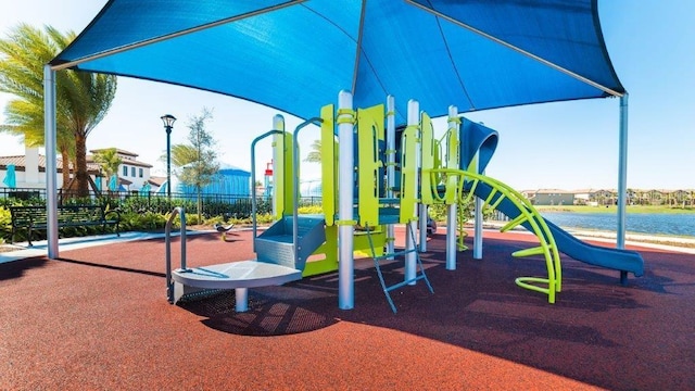 view of jungle gym with a water view