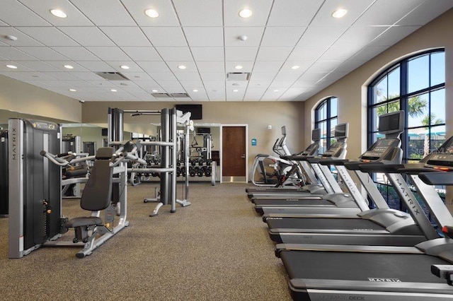 gym featuring a paneled ceiling