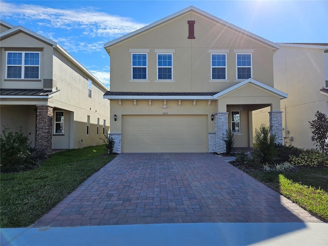 view of front facade with a garage and a front lawn