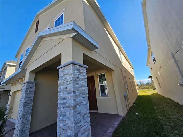 view of side of home featuring a garage