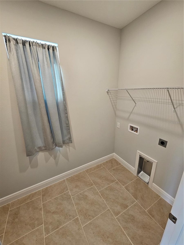 laundry area featuring washer hookup, tile patterned floors, and electric dryer hookup