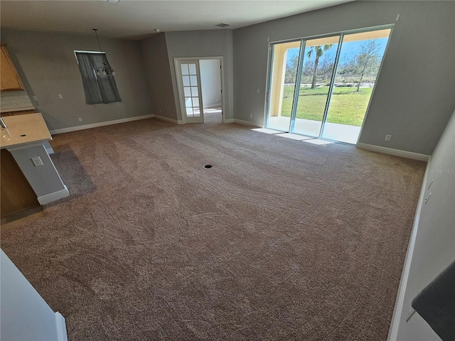 unfurnished living room with carpet floors