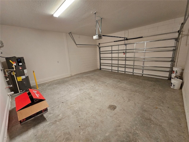 garage with a garage door opener and electric water heater