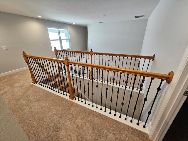 staircase with carpet