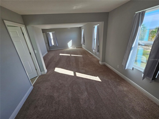 interior space featuring dark colored carpet