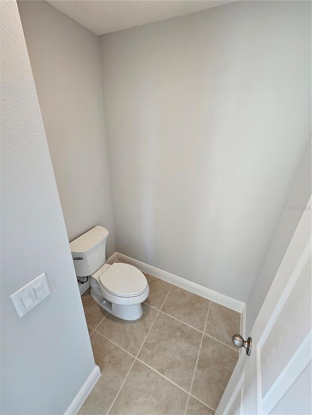 bathroom featuring tile patterned floors and toilet